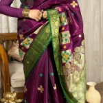 Manikyini (माणिक्यिनी) – Royal Purple Silk Saree with Green-Gold Zari , Stonework